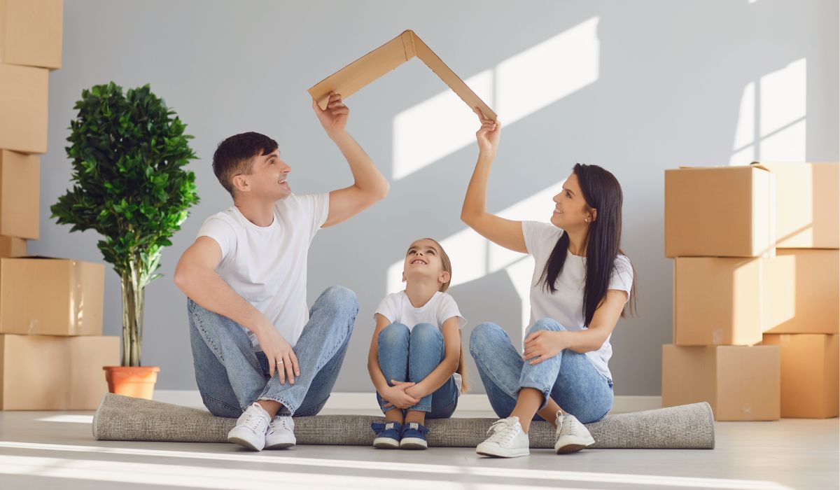 family inside a house with boxes