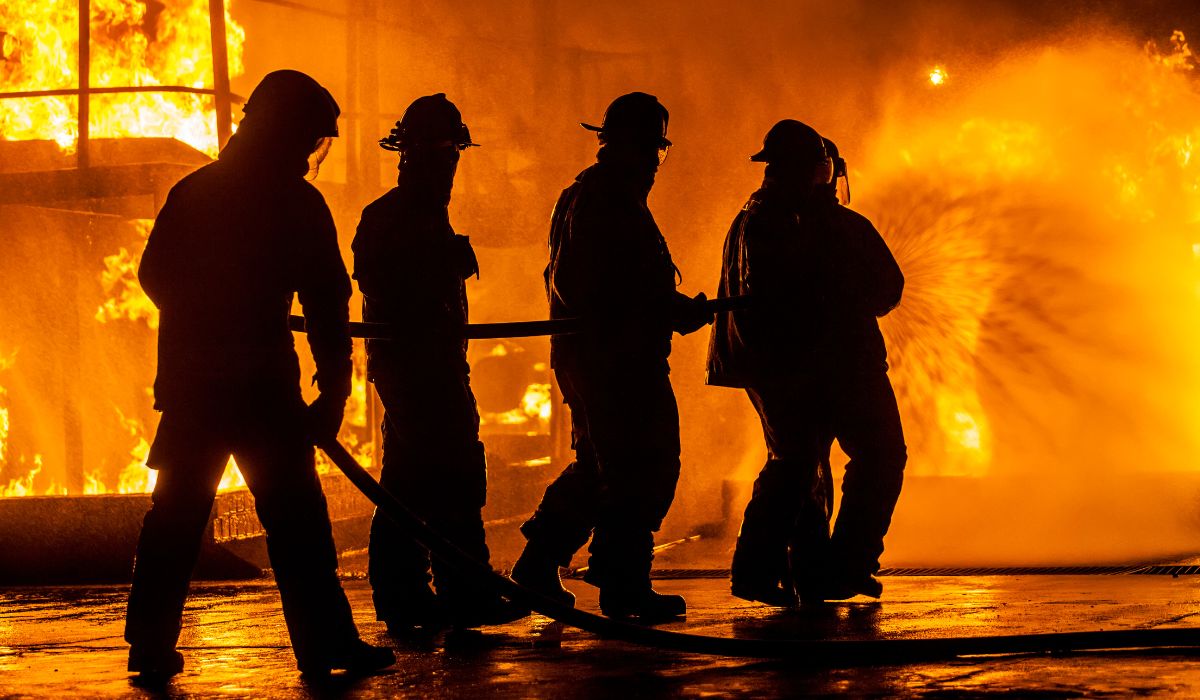 firefighters fighting a fire outside