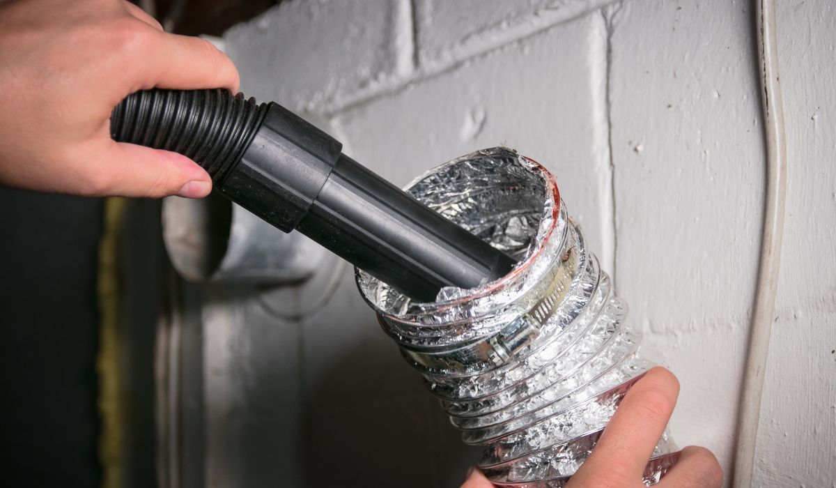 people cleaning vent