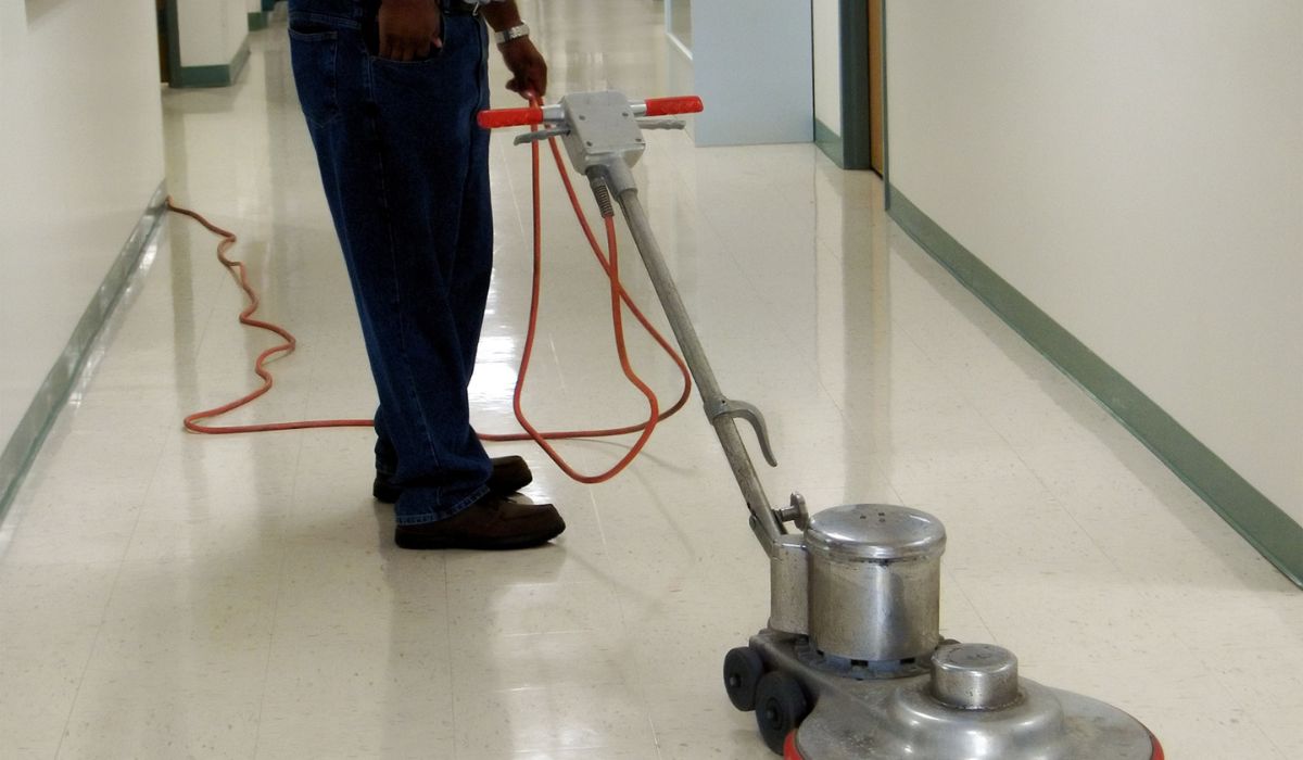 person drying floor in a building