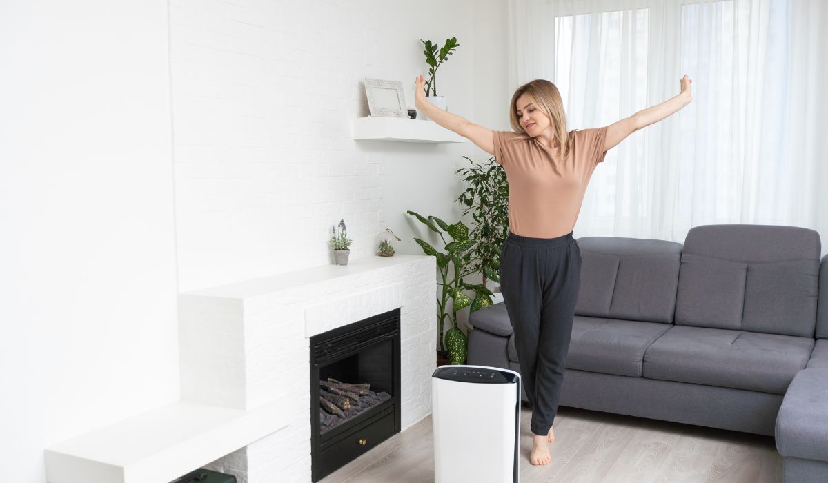 person in living room with humidifier