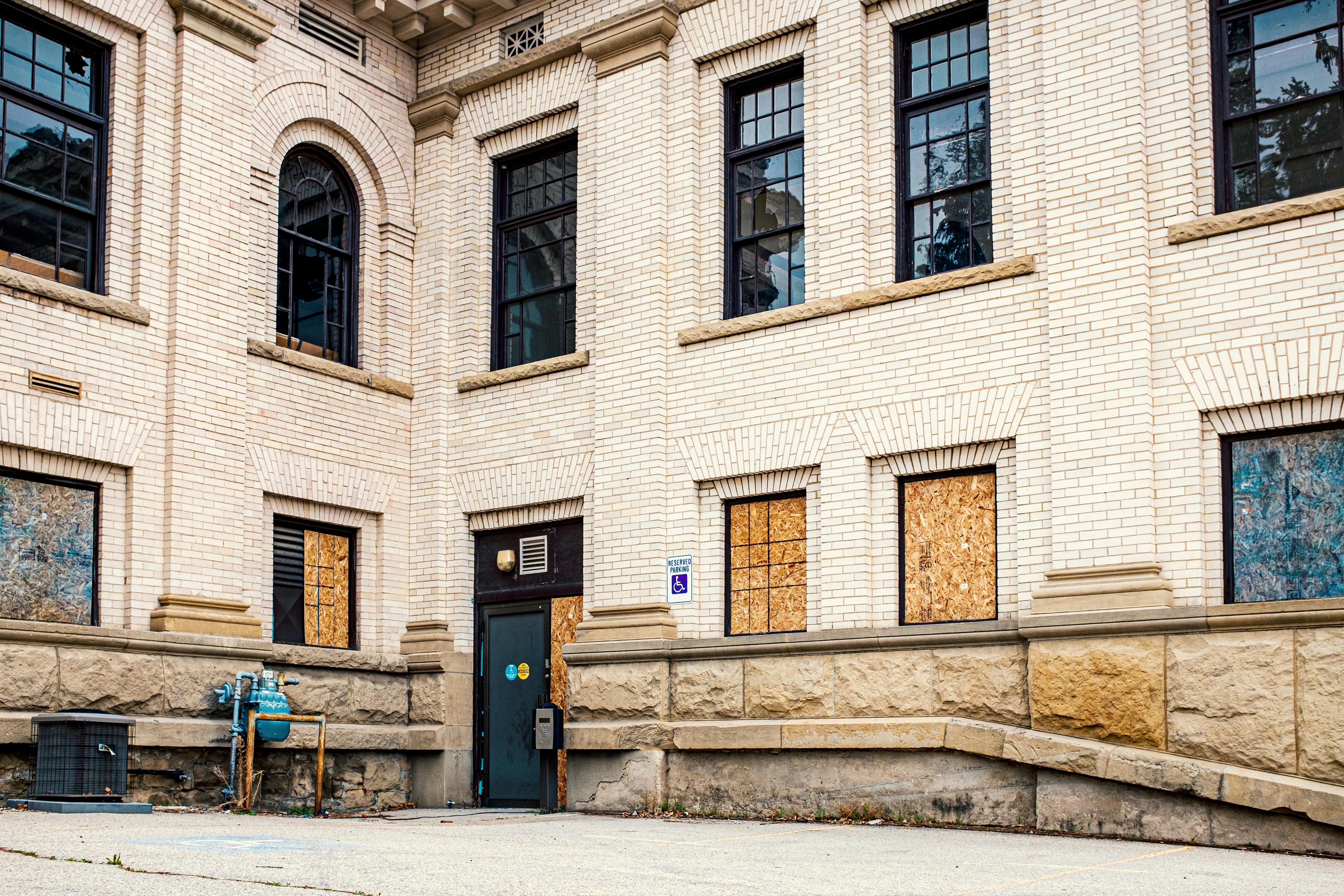 windows boarded up at facility