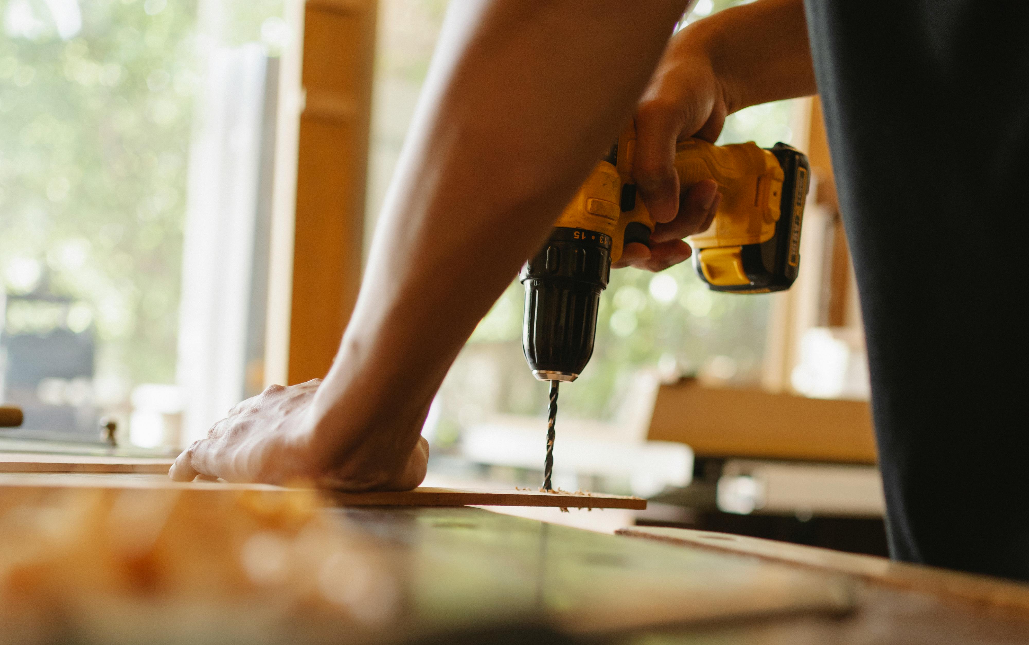 person fixing wood