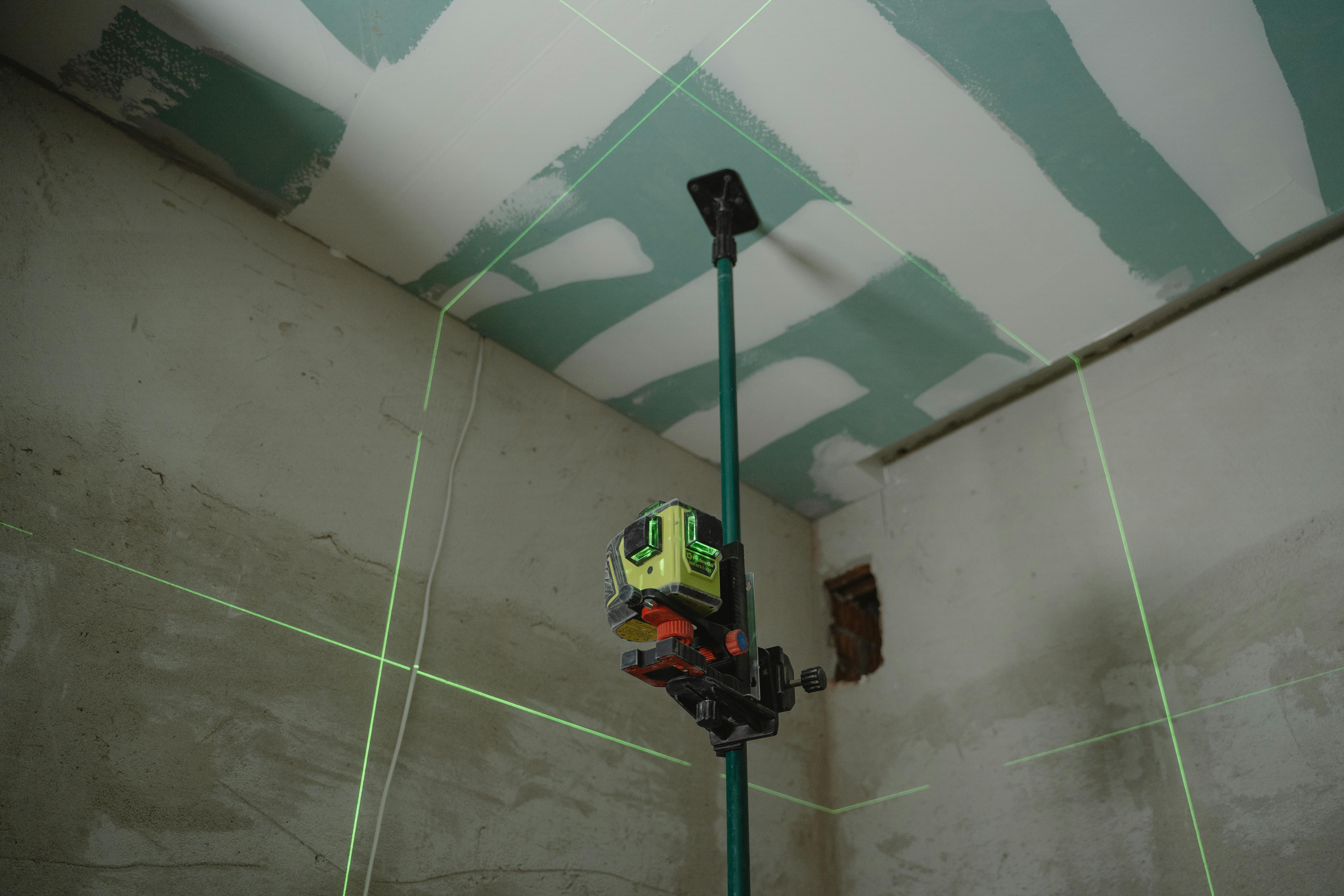 laser tool measuring drywall