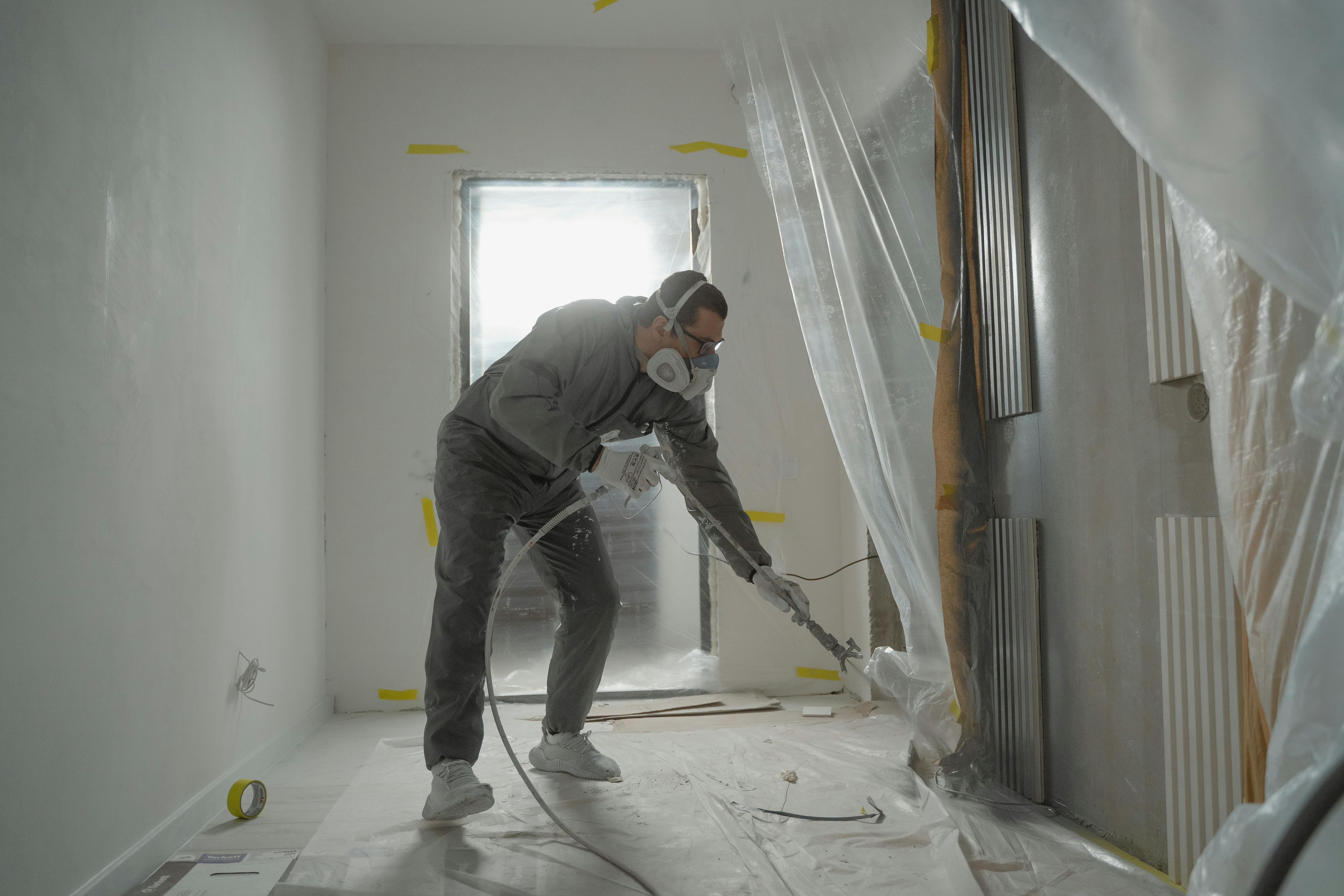 man finish up a painting job